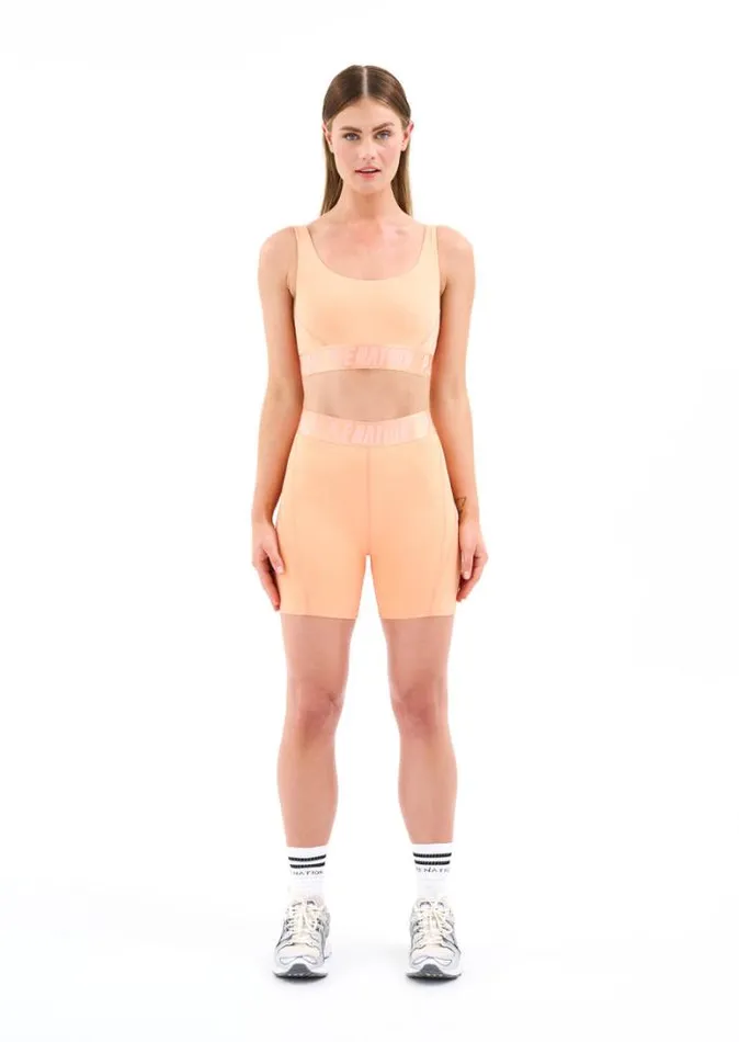 Shop BACKCHECK BIKE SHORT IN CANTALOUPE PE Nation Shorts